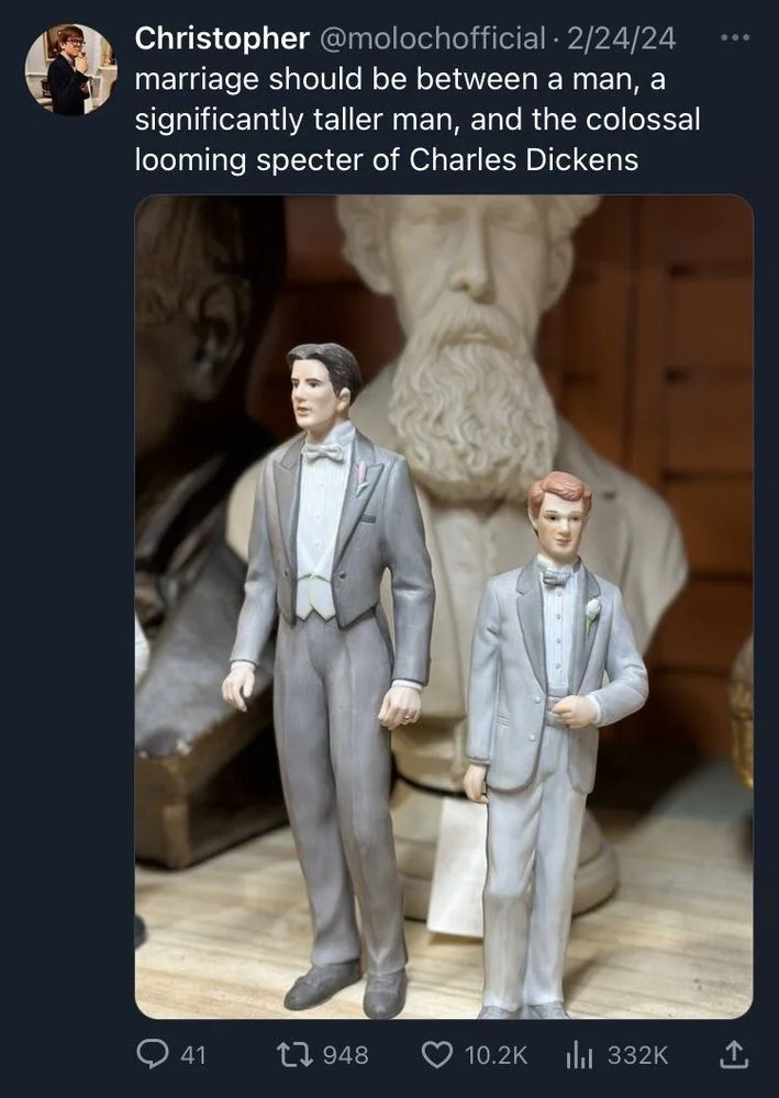 marriage should be between a man, a significantly taller man, and the colossal looming specter of Charles Dickens

(Photo of two small groom wedding cake figurines and a giant bust of dickens)